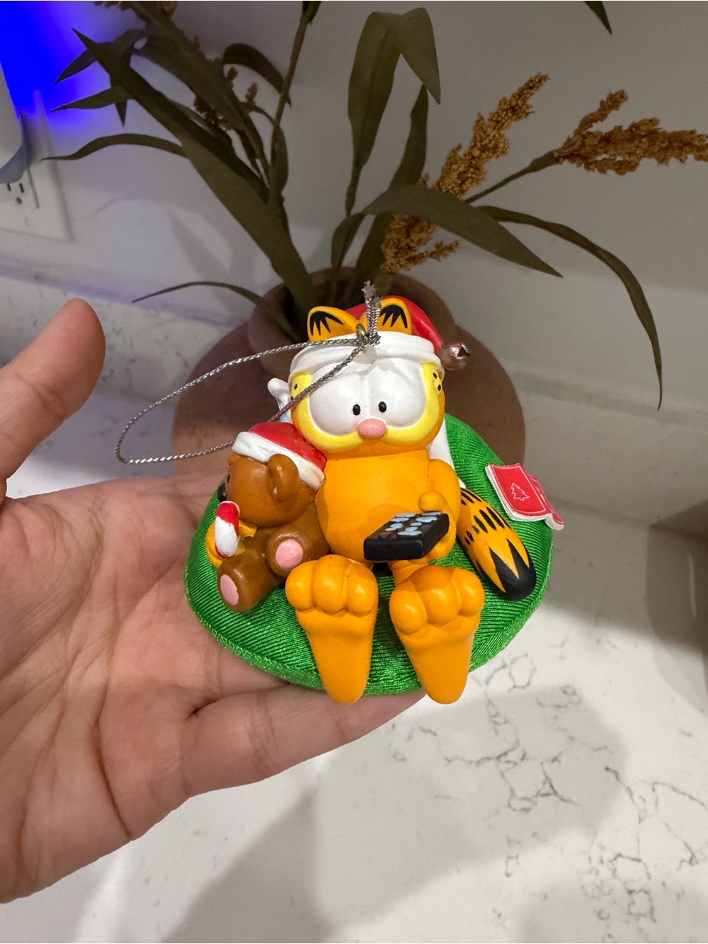 Festive Orange Cat Ornament with Green Base and Teddy Accessory
